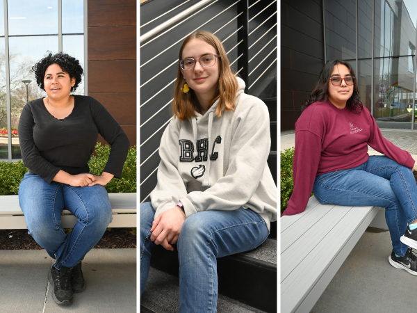 Three girls sitting on campus