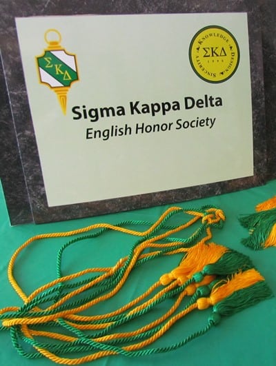 Sigma Kappa Delta sign with green & gold tassels