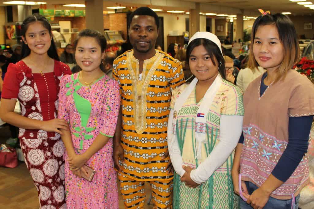 4 women & 1 man in colorful clothing from Thailand, Togo & Karen State