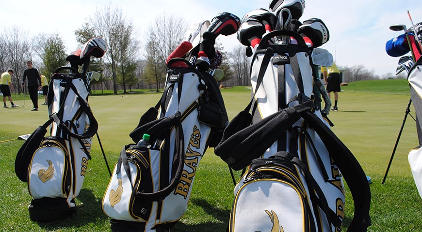 Golf bags lined up at the course