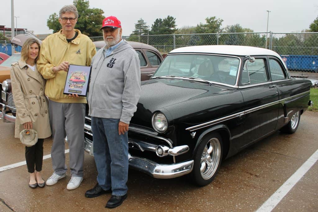 Becky Wynes & BHC President Tim Wynes presenting President's Choice Award to Gary Crowe in front of his 1954 Ford