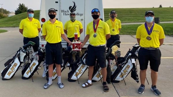 6 golfers with awards and golf bags