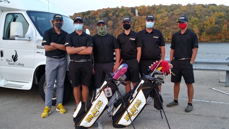 6 golfers wearing masks & standing with 2 golf bags