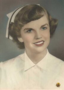 head & shoulders shot of woman wearing 1950s nursing uniform