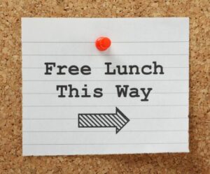 Free lunch this way note tacked on cork board