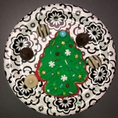 decorated Christmas tree cookie on plate