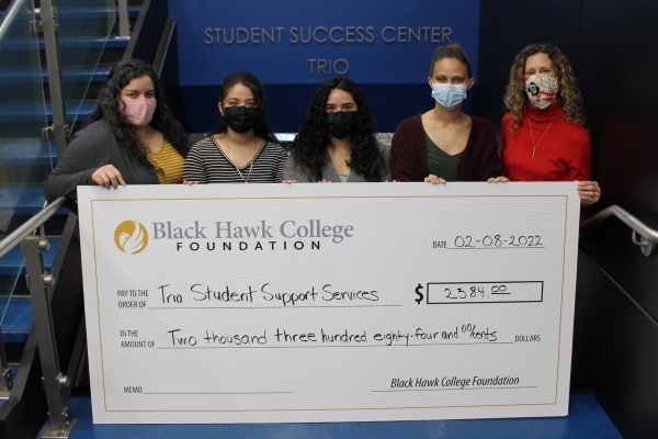 5 people holding oversized check