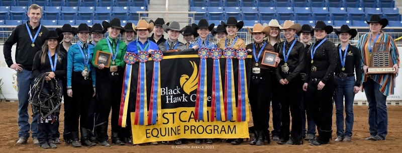 Group of Western riders standing with ribbons & awards