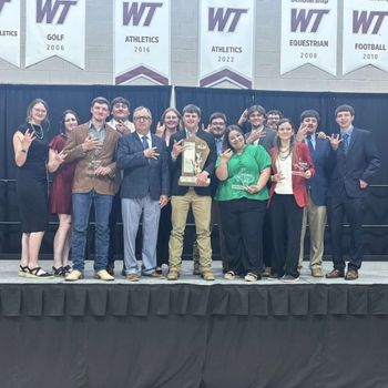 2025 soil team holding nacta trophy with larson