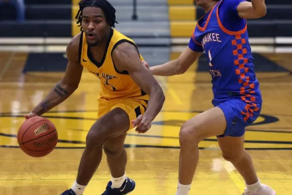 Basketball players in action on court.