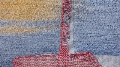 closeup of woven artwork.