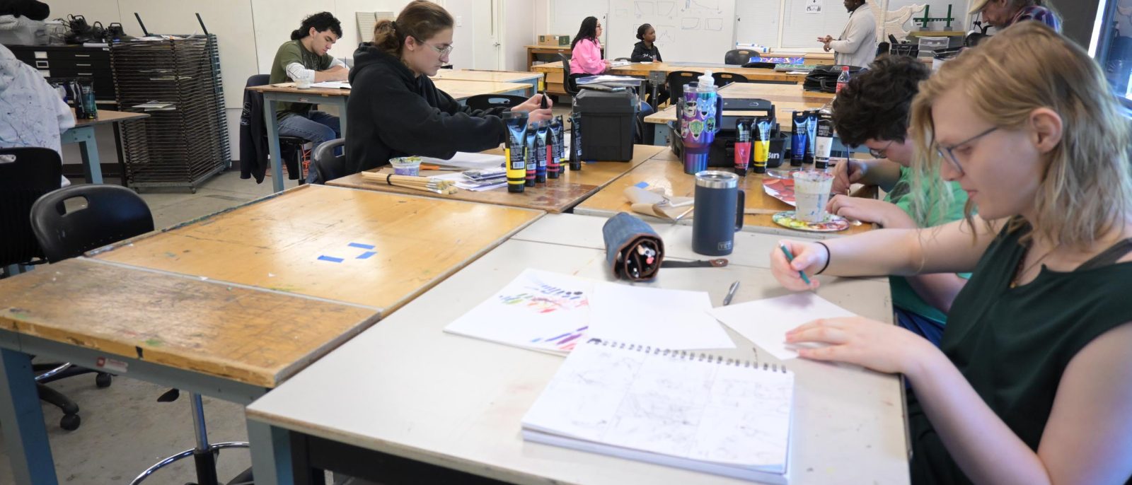 Students engaged in art class activities.