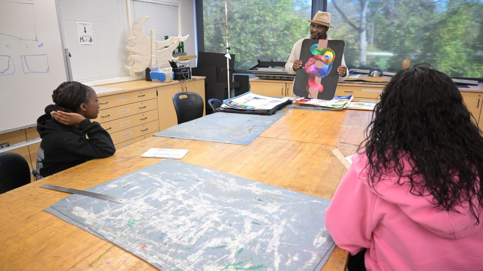 Students engaged in art class activity.