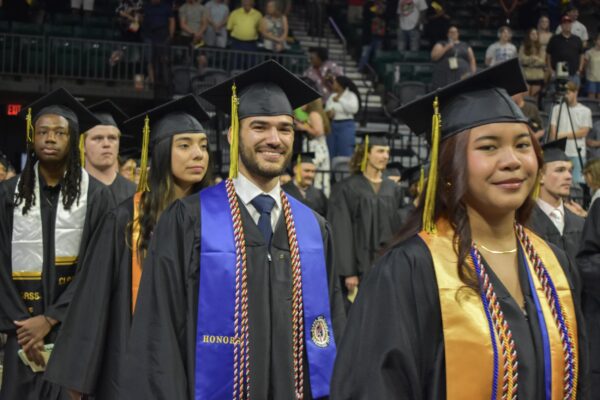 Sub-brands A group of people in graduation gowns and caps