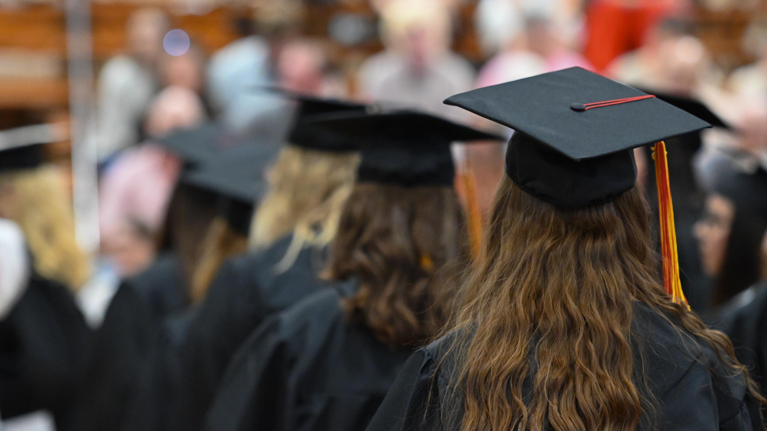 A group of people in graduation gowns