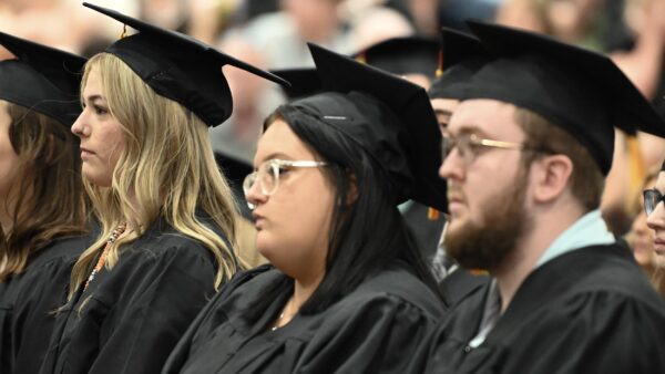a group of people in graduation gowns