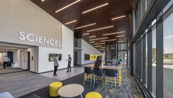 Modern lobby with seating and signage.