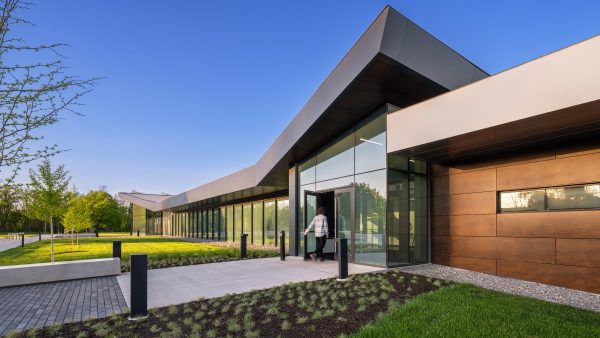 Modern building entrance with landscaping.