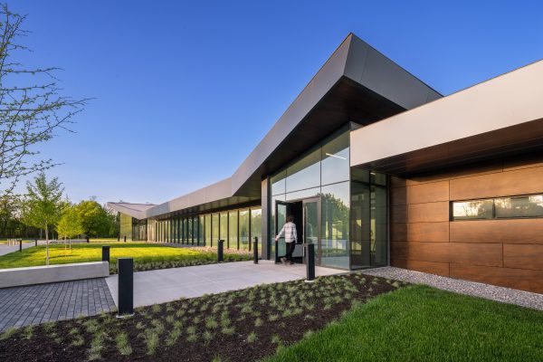 Modern building entrance with landscaping.