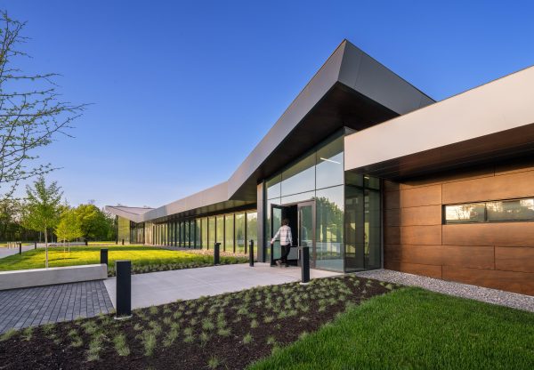 Modern building entrance with landscaping.