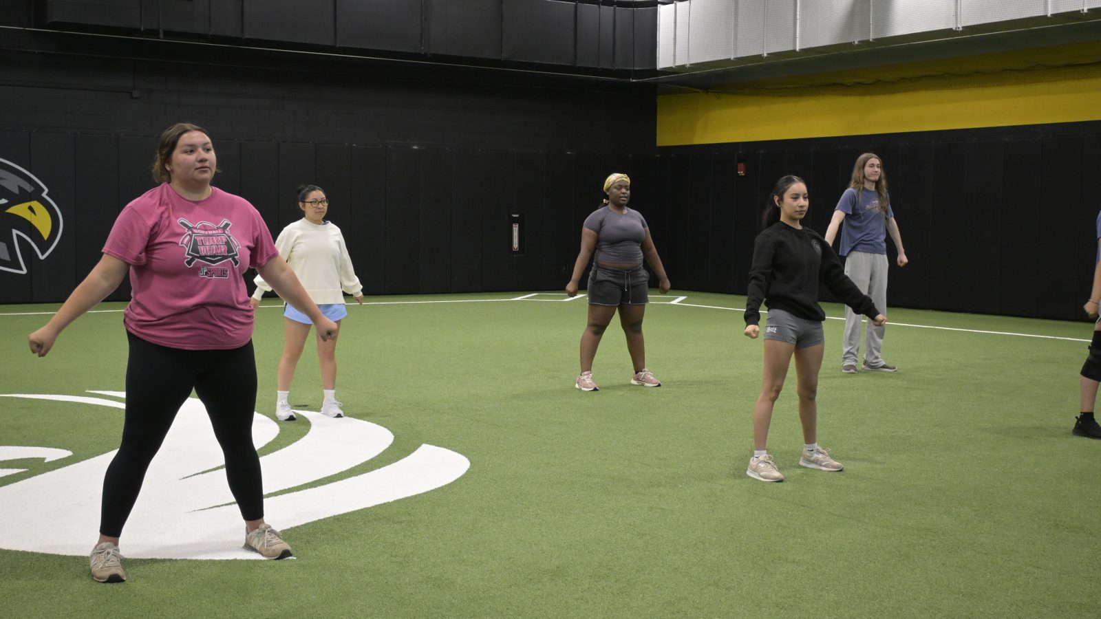Spirit squad brings school pride to qc campus Students hitting their cheer poses in the turf room at spirit squad camp on june 5.