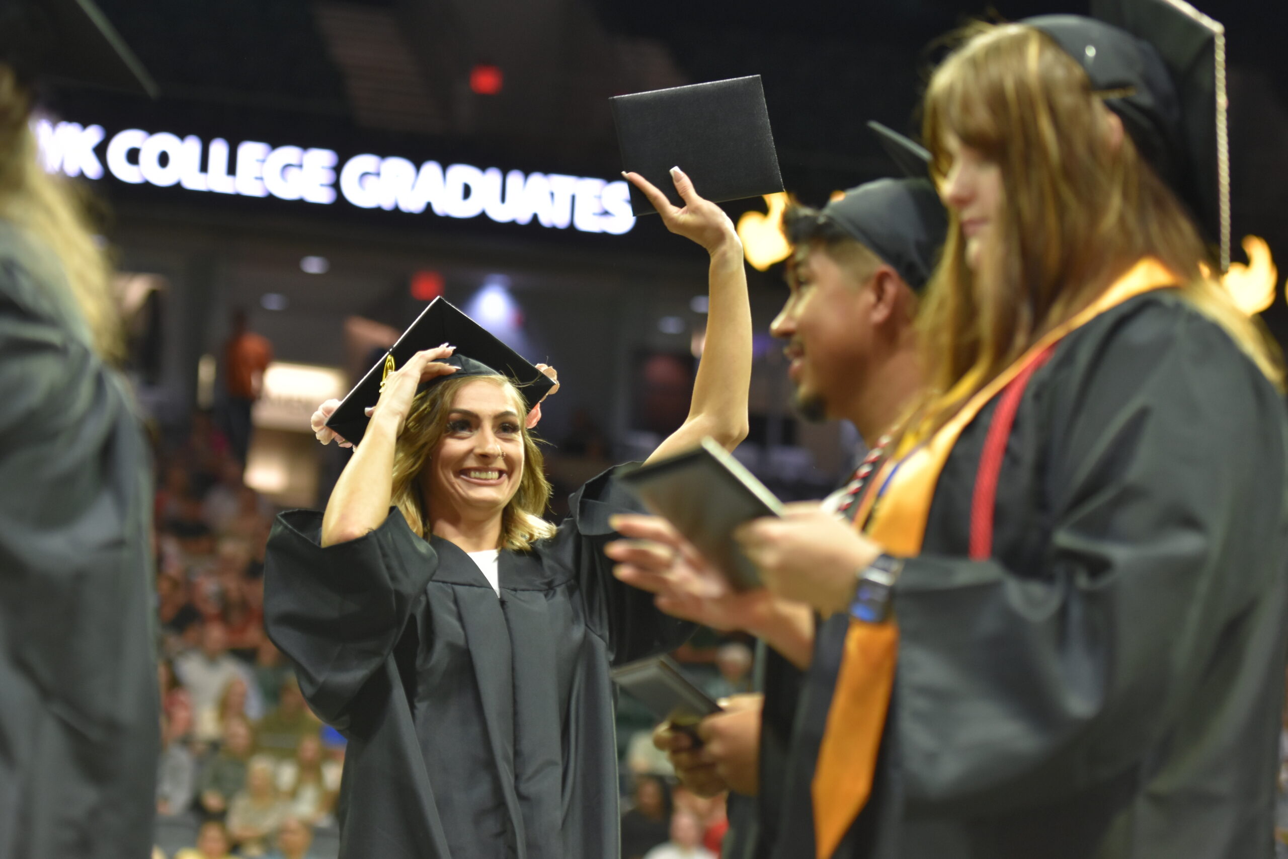 A group of people in graduation gowns and caps