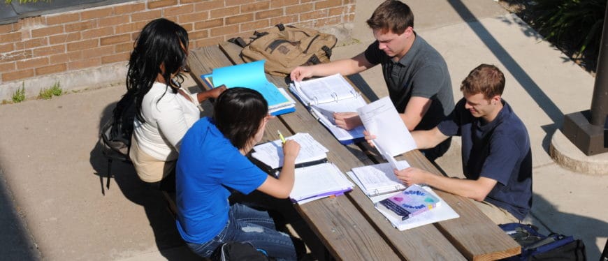 A group of people studying at a table