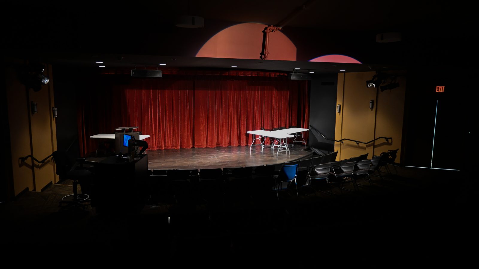 The black hawk college stage with dramatic lighting