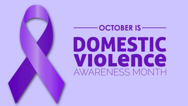 Purple ribbon on purple background with text october is domestic violence awareness month.