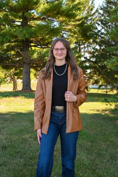Person in brown jacket outdoors