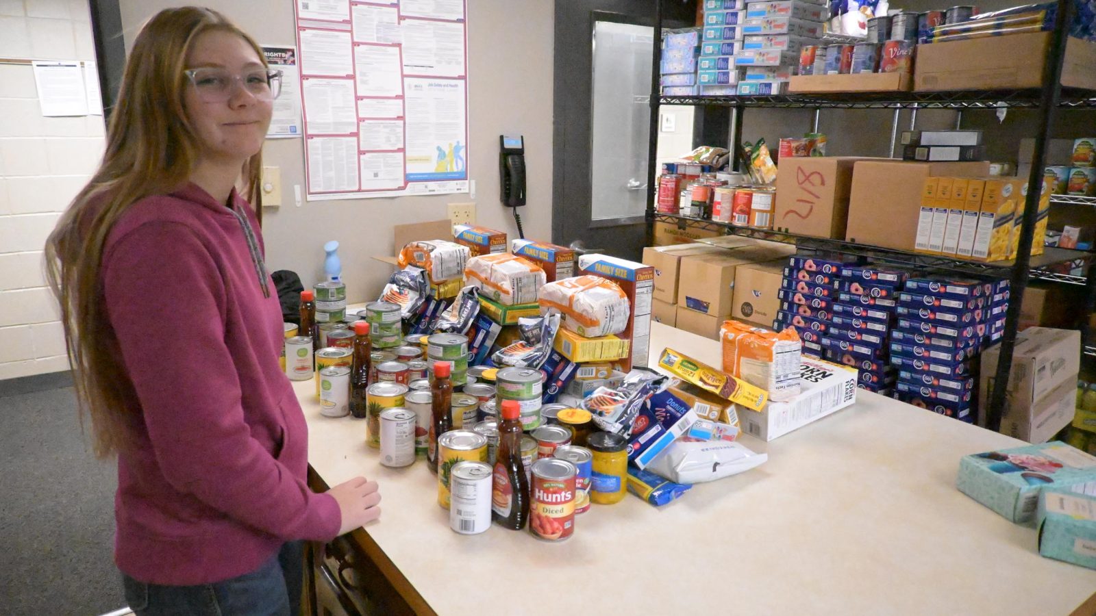 Bhc food pantry Table filled with food pantry items.