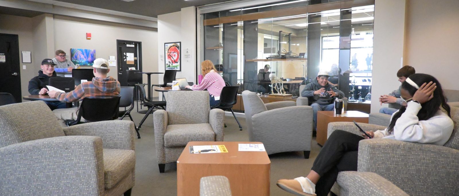 Social sciences Students socializing in a lounge area.