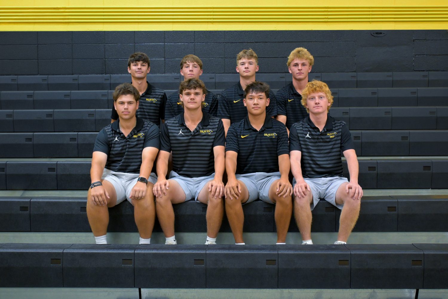 Golf roster Eight golf athletes in team uniforms