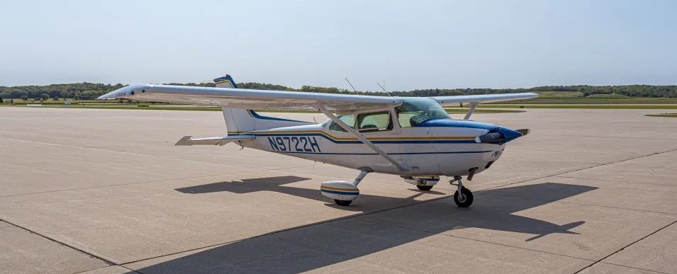Single-engine airplane on tarmac.