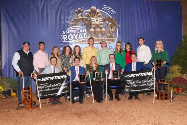Group photo of black hawk east’s winning junior college livestock judging team holding plaques and banners at the 2025 american royal.