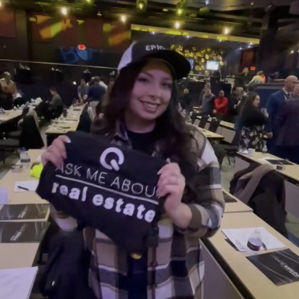 Woman promoting real estate at event