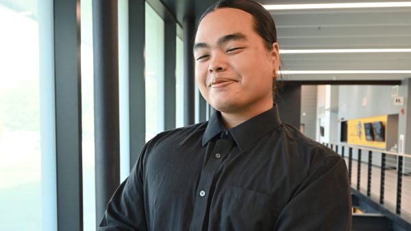 Smiling person in a black shirt