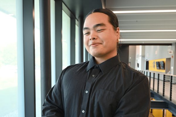 Smiling person in a black shirt