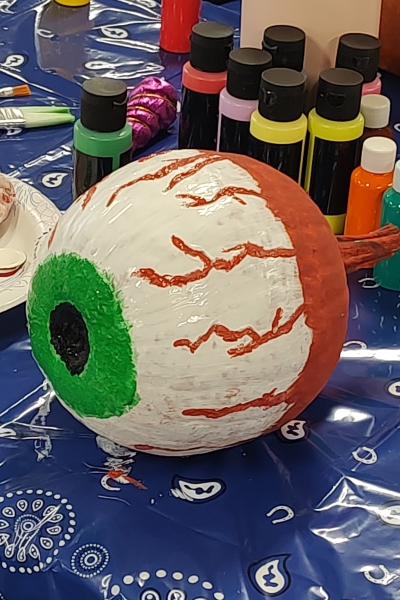 Pumpkin painted to look like bloodshot eyeball.