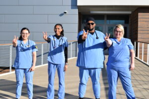 A group of people in blue uniforms