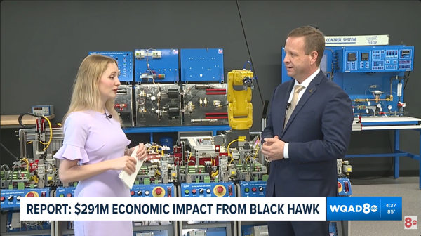 Interview in front of machinery