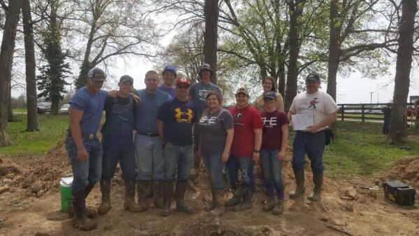 Larson and students working with soil