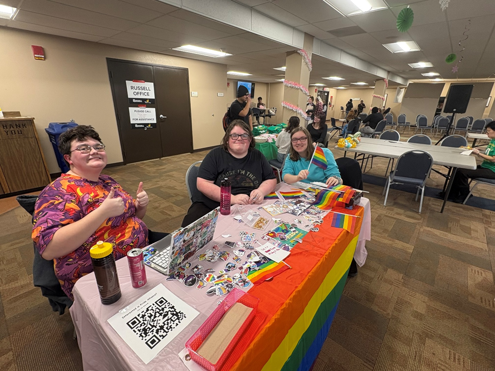 Pride alliance remains a community circle for bhc Jen and two members of the pride alliance sit at their table at club fest