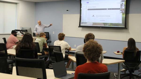 Academic departments Instructor teaching in a classroom setting.