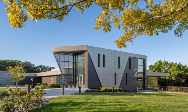 Modern building with landscaped entrance.