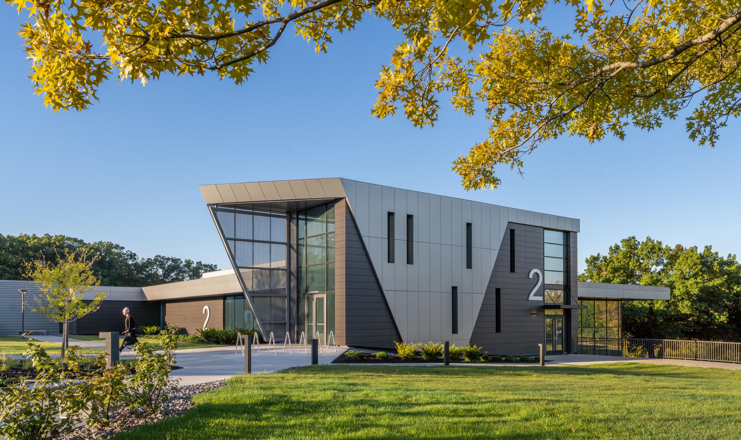 Modern building with landscaped entrance.