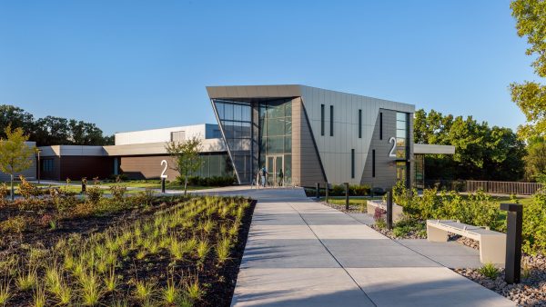 Modern building with landscaped pathway.