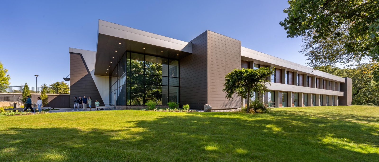 Modern building with landscaped surroundings.