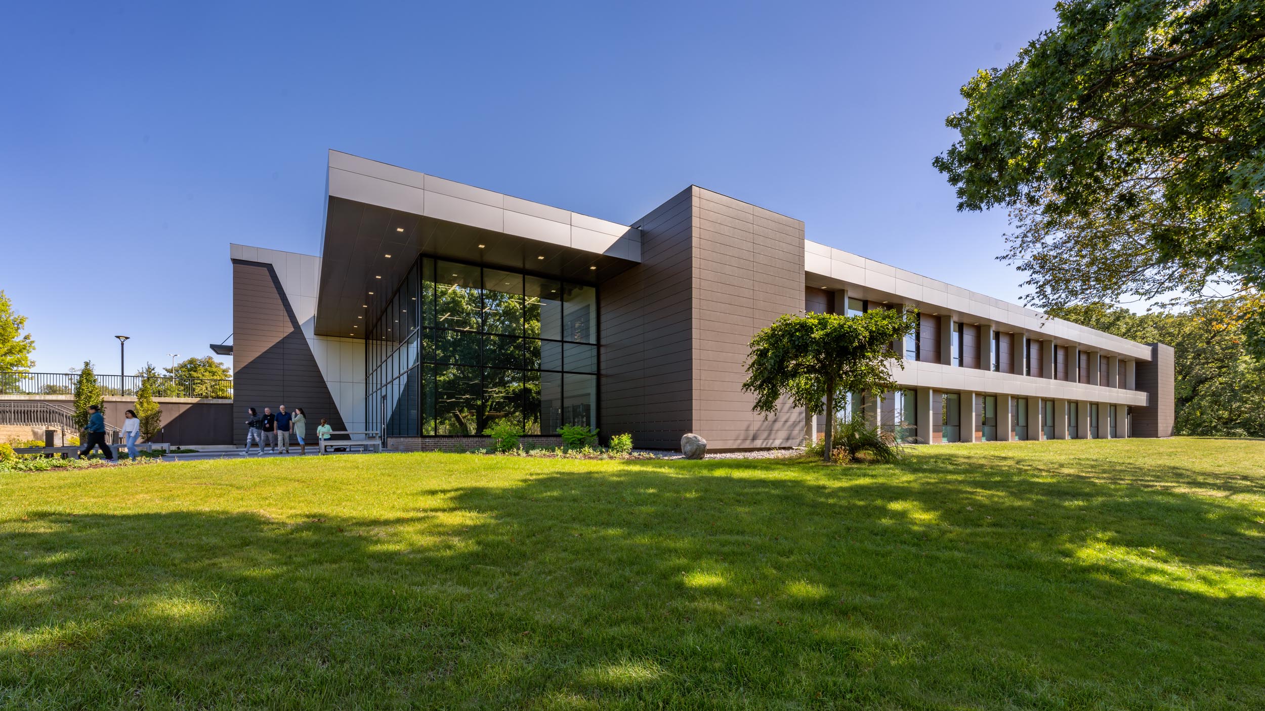 Modern building with landscaped surroundings.