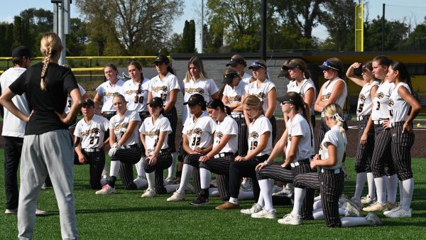 Softball schedule Team photo on a softball field.